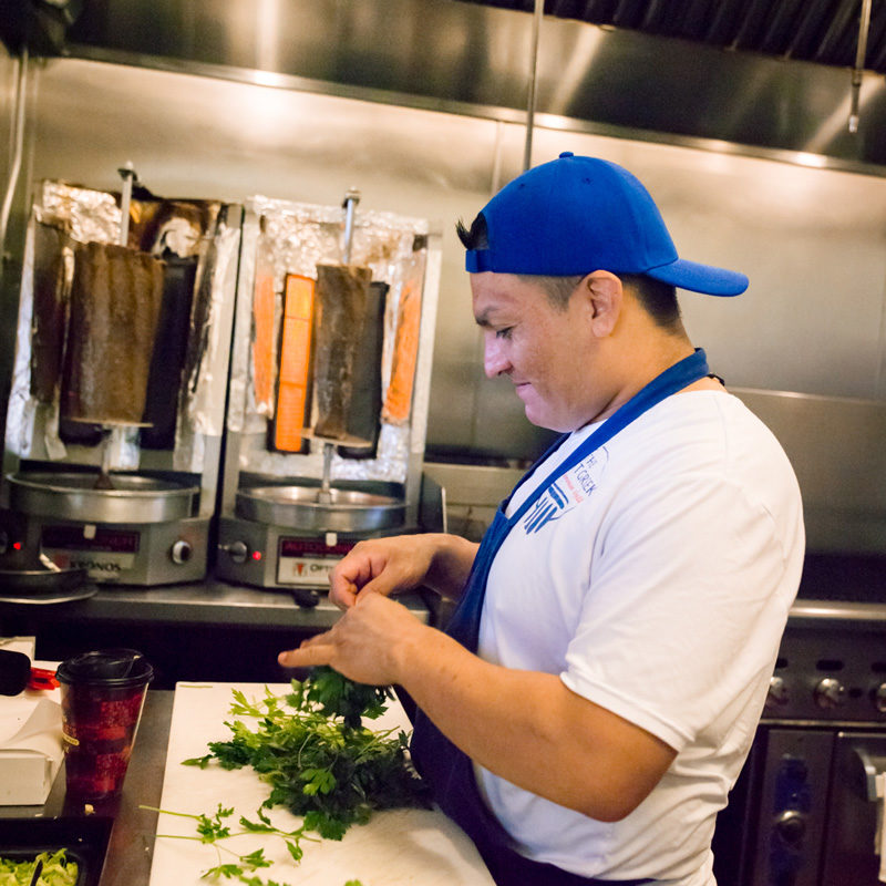preparing delicious Greek food in the Great Greek Mediterranean Grill